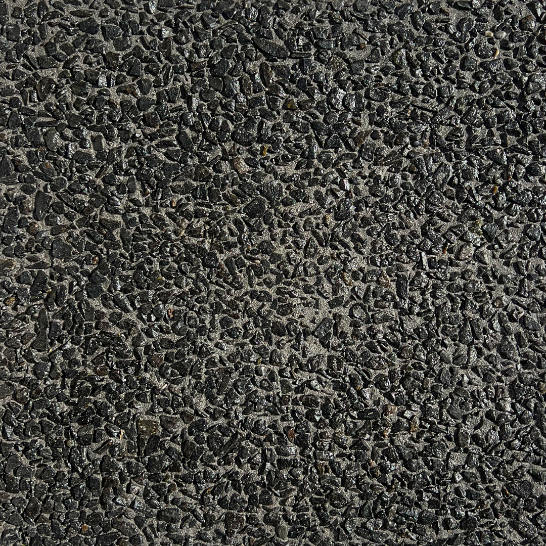 close up swatch of exposed aggregate concrete in mix Black Night