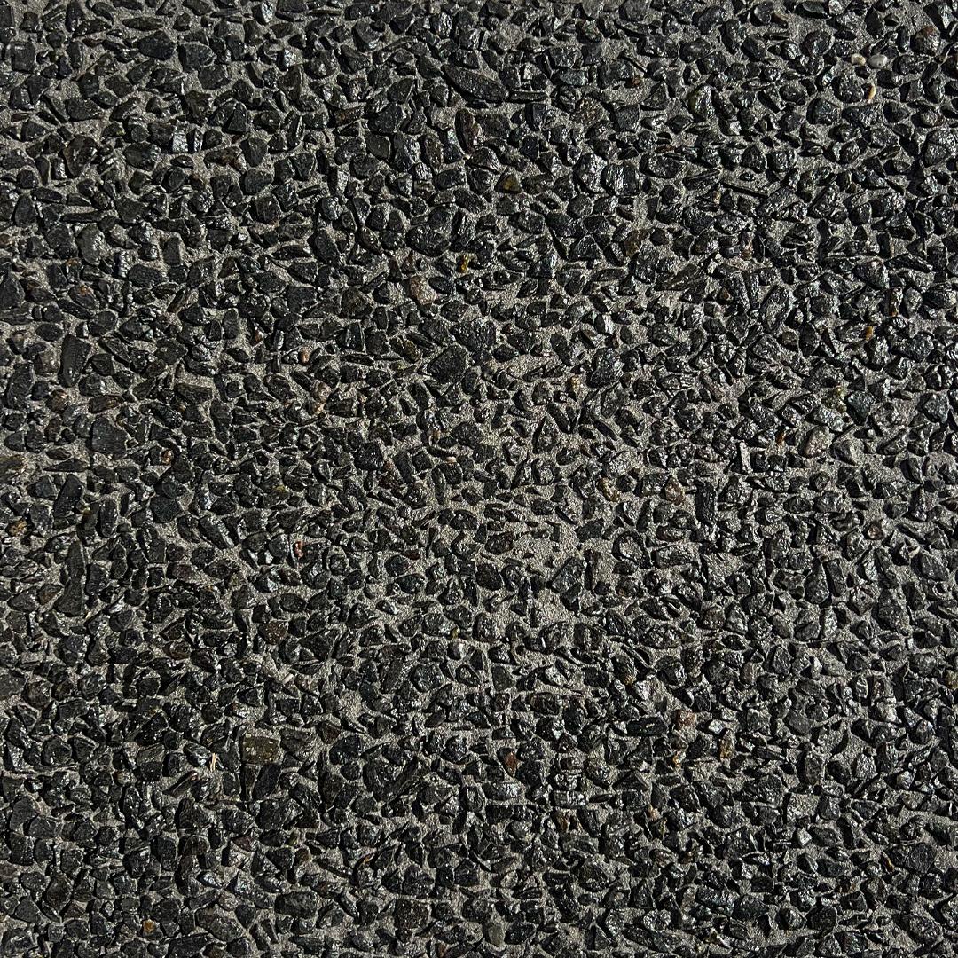 close up swatch of exposed aggregate concrete in mix Black Night