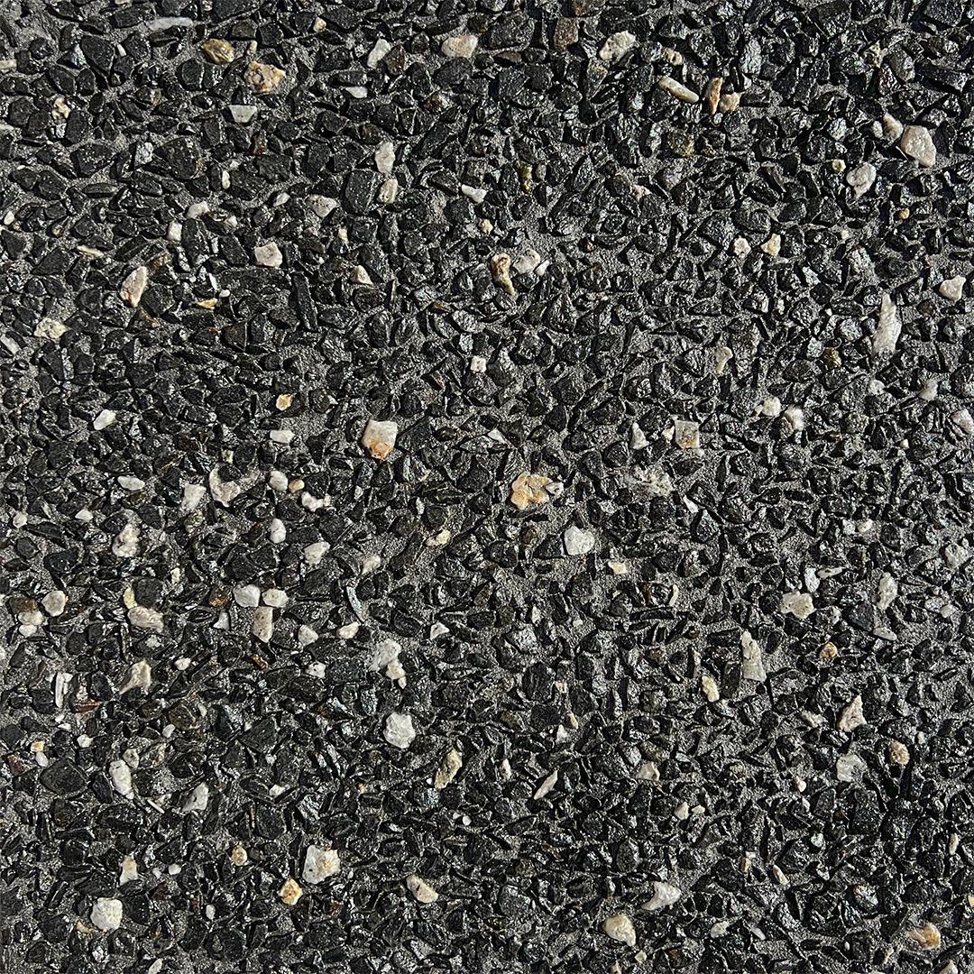 Close up swatch of exposed aggregate concrete in mix Night Sky