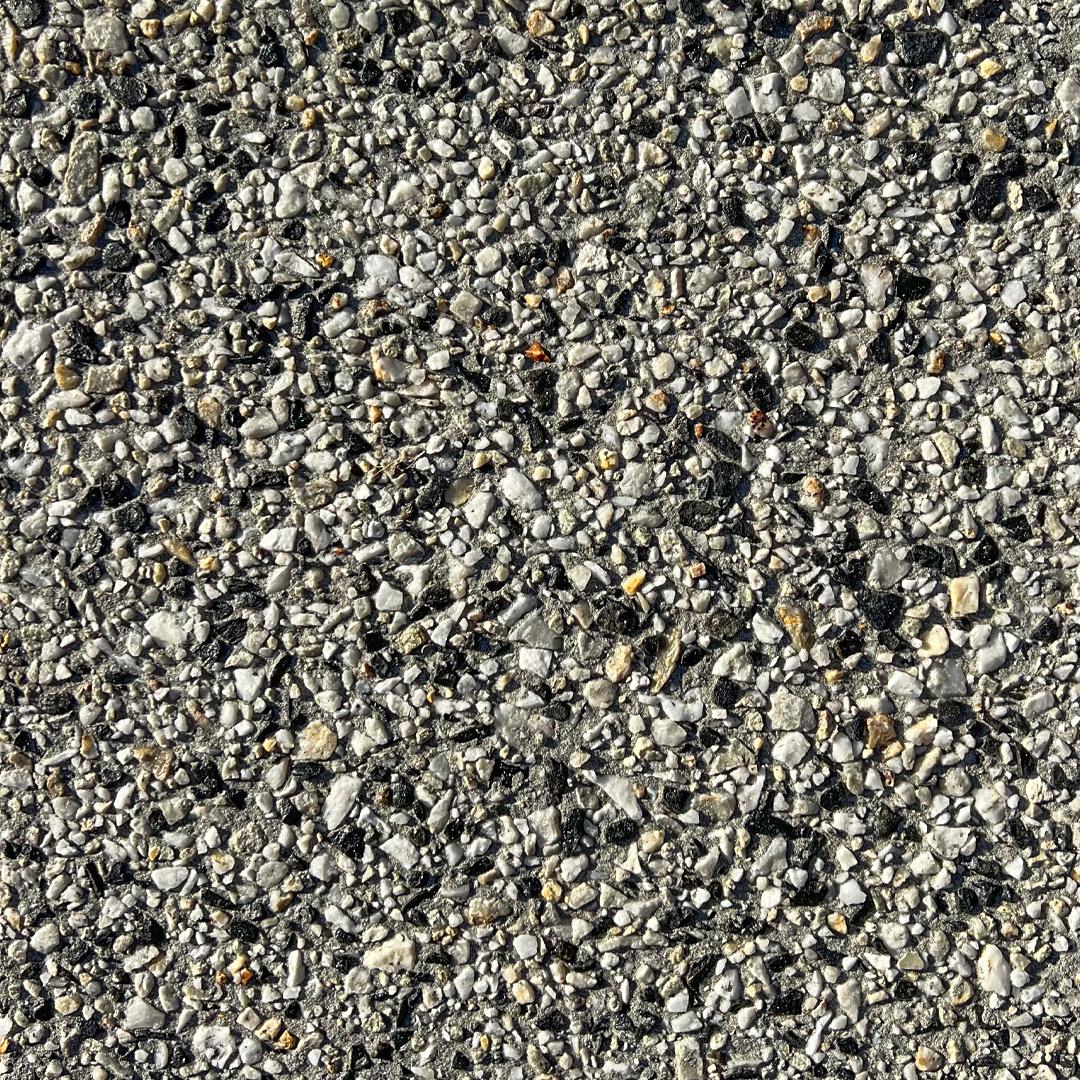 Close up swatch of exposed aggregate concrete in the shade Ocean Floor
