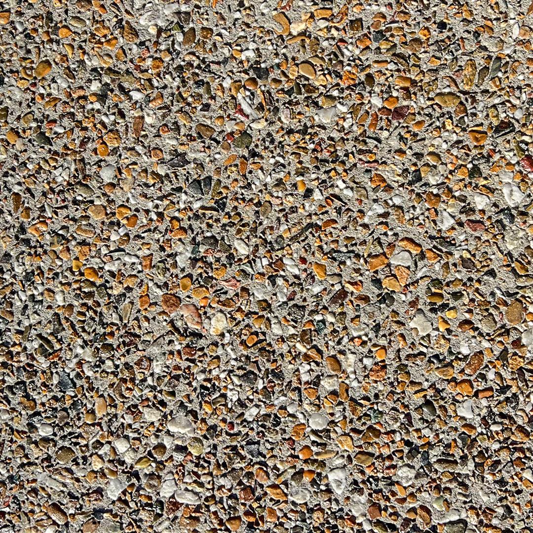 Close up swatch of exposed aggregate concrete in mix Winter Red